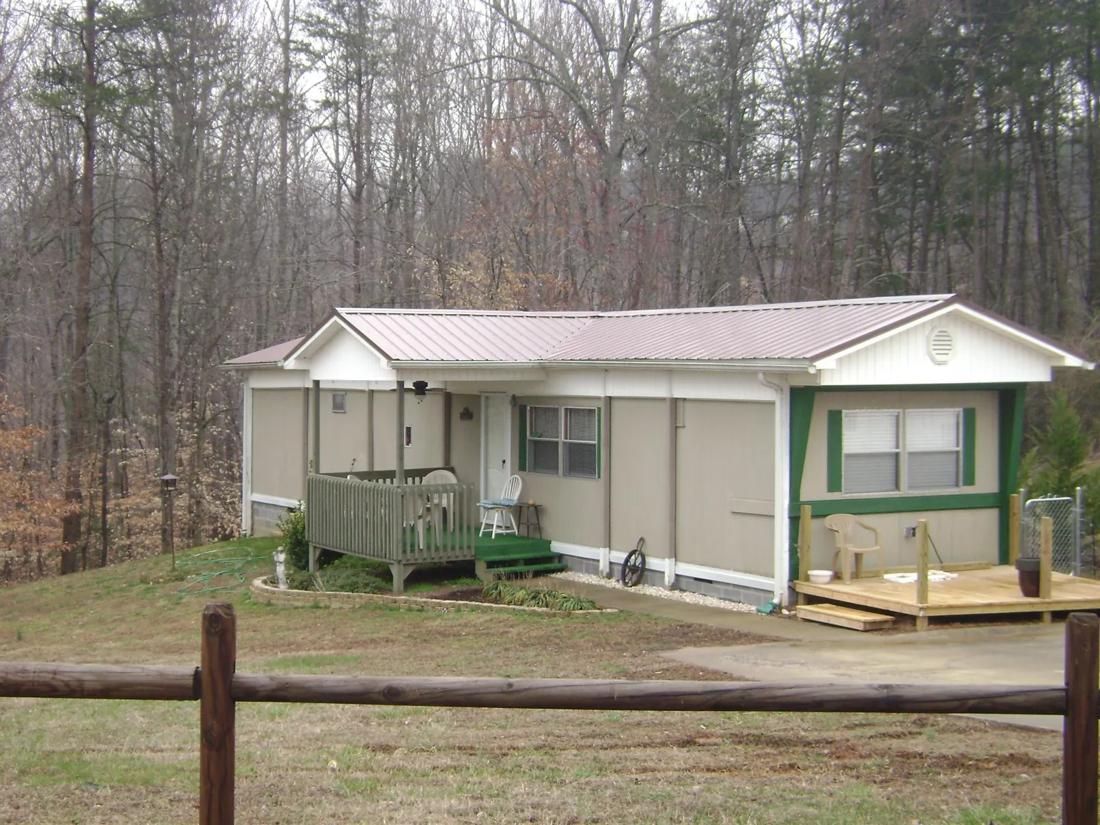 Mauve metal roof on a manufactured home with a new front deck in Millstone Township